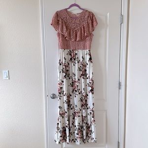 Like new! Beautiful dress with lacy top and floral skirt at the bottom.